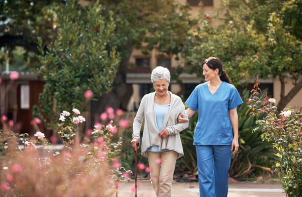 nurse walking and talking with patient